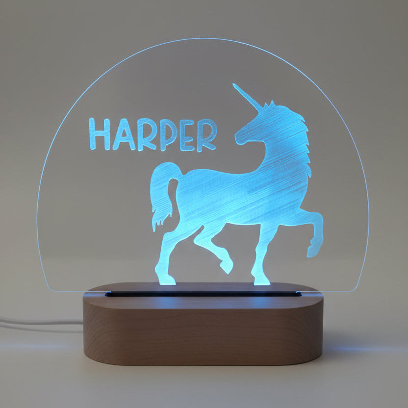 Unicorn-shaped night light with 'Harper' text