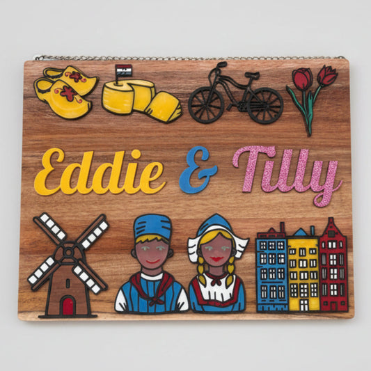Wooden sign with colorful illustrations cut from acrylic and text